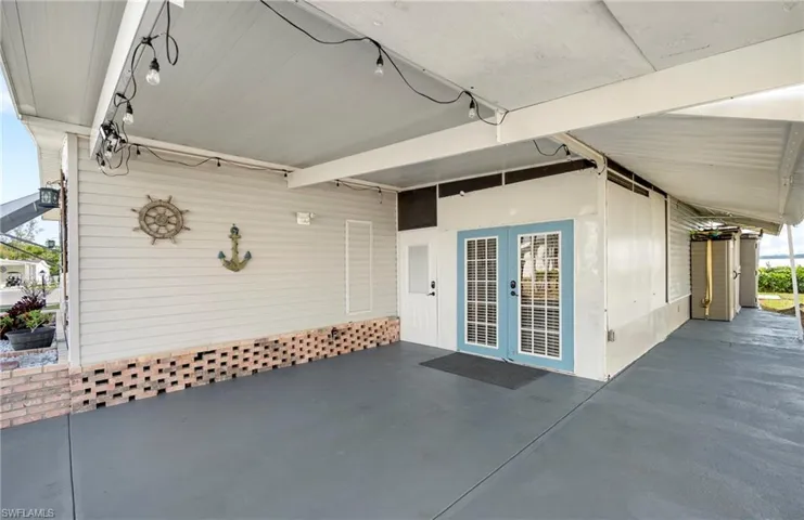 Property entrance with french doors and a patio area