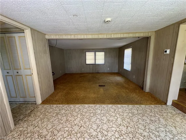 the kitchen is on the right and primary en suite on the left
