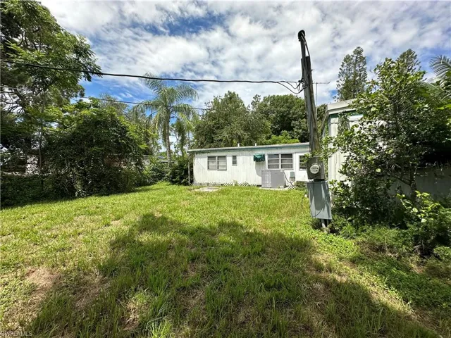 View of yard with central air condition unit by Carrier
