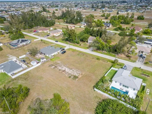 View of property location with nearby suburban area
