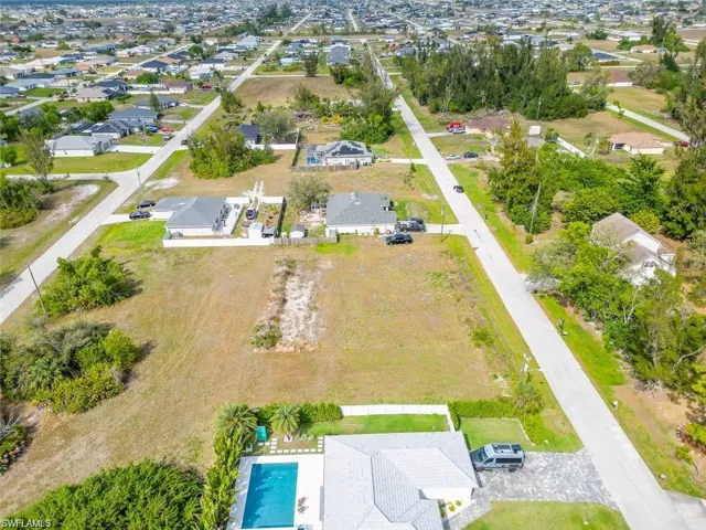 View of property location with nearby suburban area