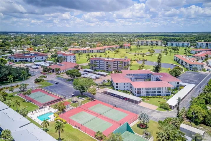Drone / aerial view of a large body of water and a local golf course