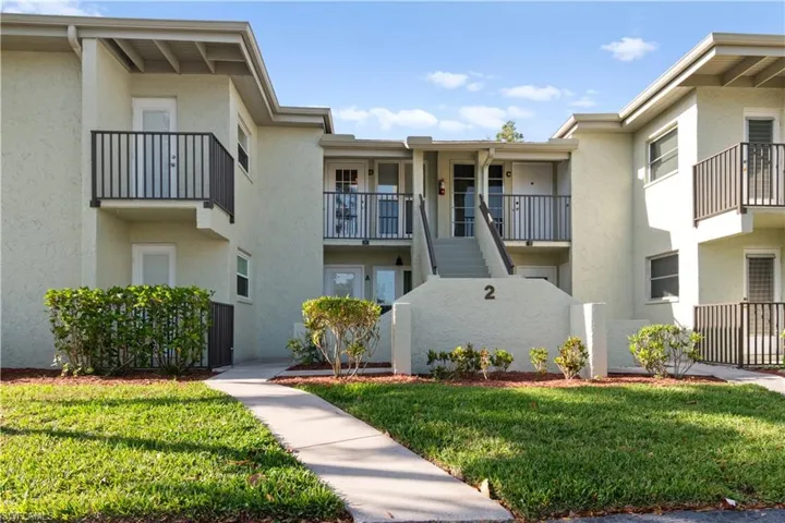 View of apartment building / complex with stairs