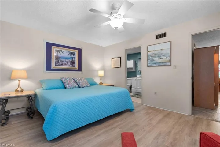 Primary bedroom with light wood-style floors