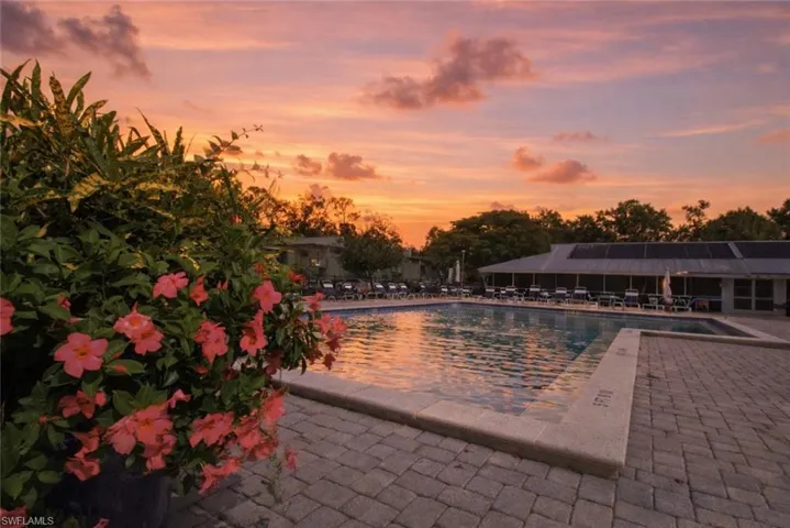 Community pool with a patio