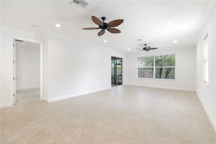 Empty room featuring ornamental molding, recessed lighting, a ceiling fan, and light tile patterned flooring