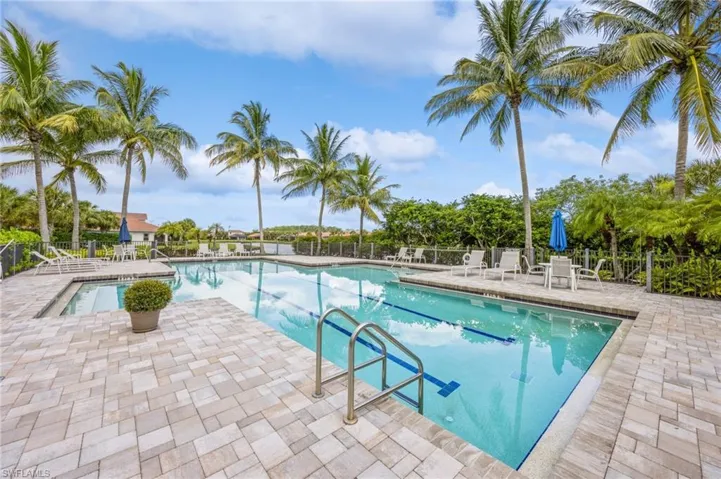 Community pool with a patio