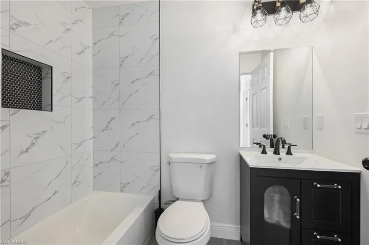 Full bathroom featuring vanity and tub / shower combination