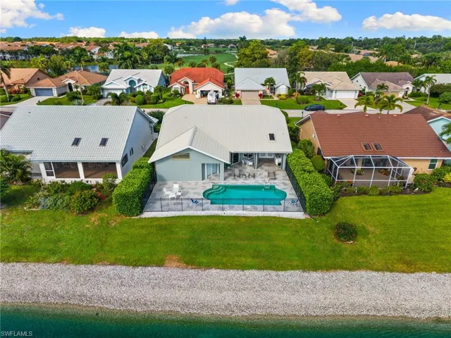 Aerial view of residential area featuring a pool area