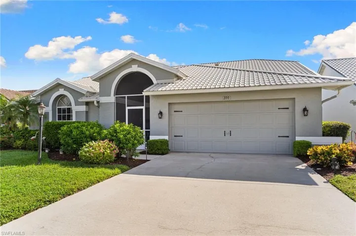 Ranch-style house featuring stucco siding, driveway, an attached garage, a front yard, and a METAL roof