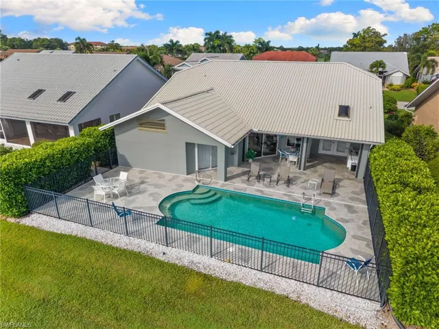View of pool with a patio area, a residential view, and outdoor dining space