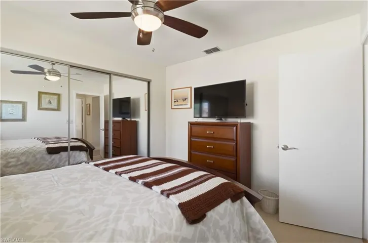 Bedroom featuring a closet and ceiling fan