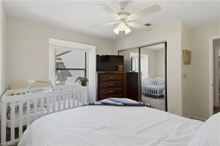 Bedroom with a closet and ceiling fan