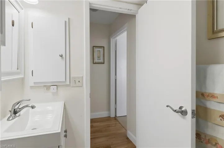 Bathroom featuring vanity and light wood-style flooring