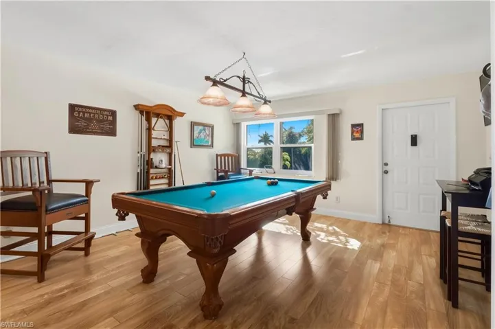 Game room featuring billiards and light wood finished floors
