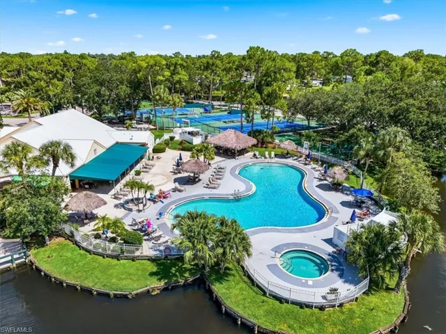 Lagoon-shaped pool with integrated spa and surrounding sun deck