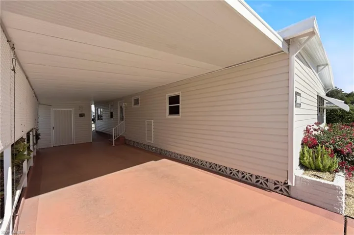 View of patio featuring a carport