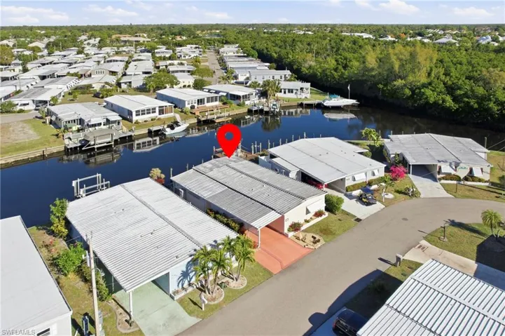 Aerial view of residential area featuring a large body of water