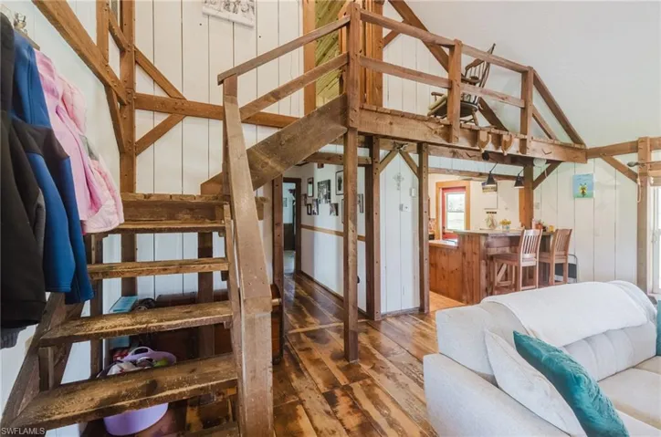 Exposed timber framing and wood-finish flooring throughout