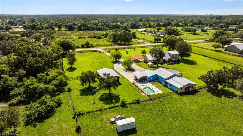 Expansive green acreage with mature trees