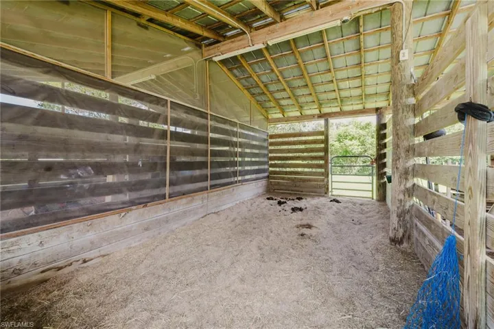Open-air structure with a metal roof and exposed wood framing