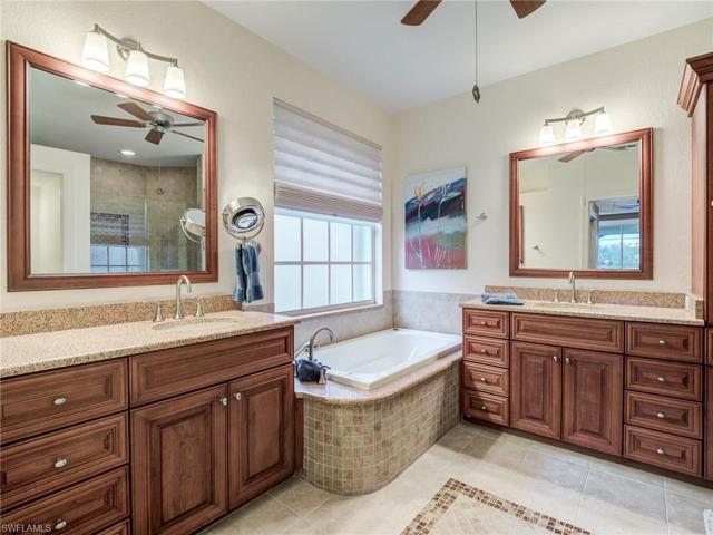 UPDATED MASTER BATHROOM WITH CUSTOM CABINETRY DUAL VANITIES