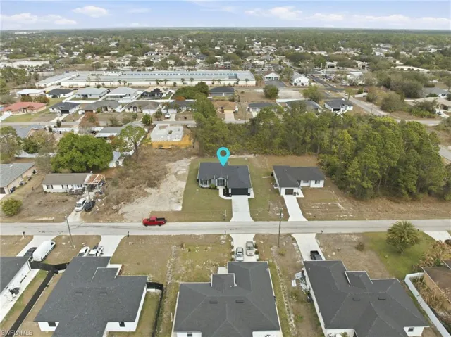 View of property location with nearby suburban area