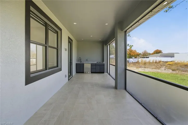 Unfurnished sunroom featuring a sink