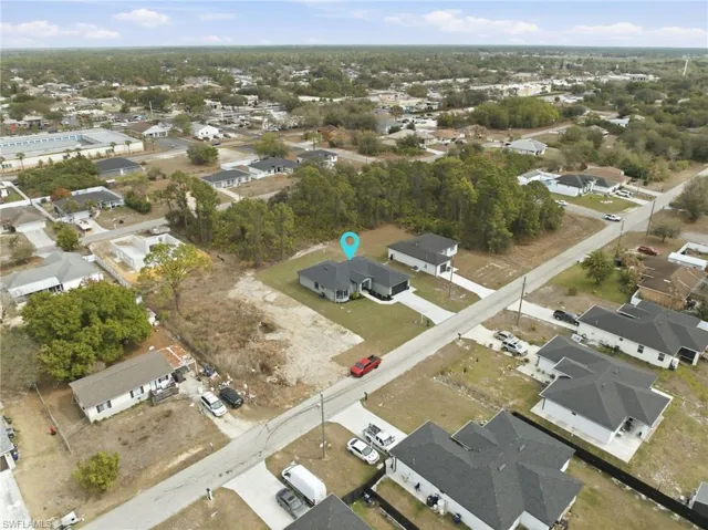 View of property location with nearby suburban area