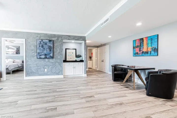 Living room facing bedroom room and front door entrance.