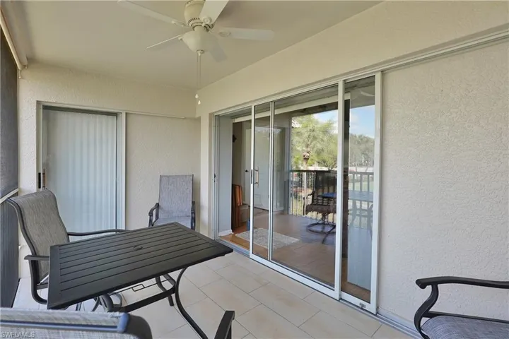 West facing lanai with tile floor single slider to primary double slider to living room