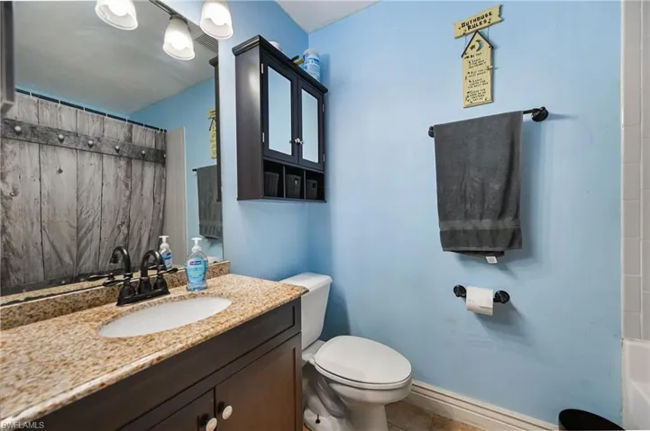 Bathroom with vanity and toilet