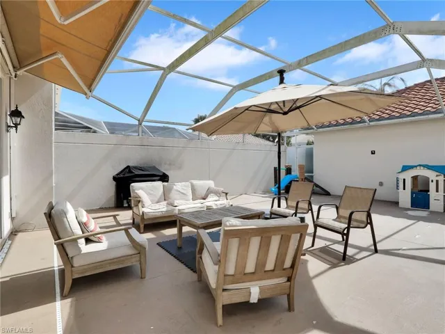 View of patio / terrace featuring a grill, a lanai, and outdoor lounge area