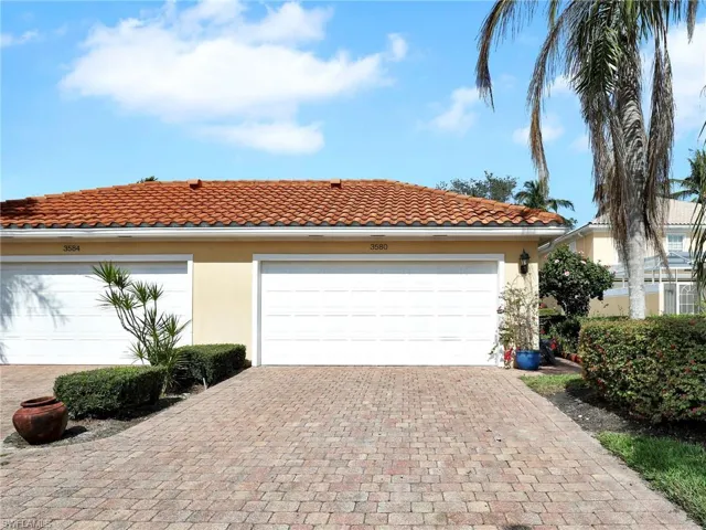 View of front facade featuring a garage