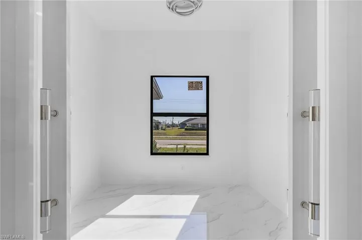 Empty room with marble tiled flooring