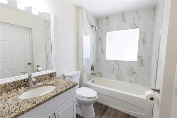 Main floor bathroom with access to the pool area