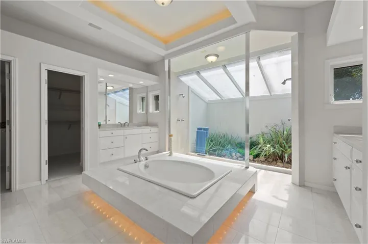 Relax, unwind and enjoy the serenity of this beautifully appointed primary bath.
