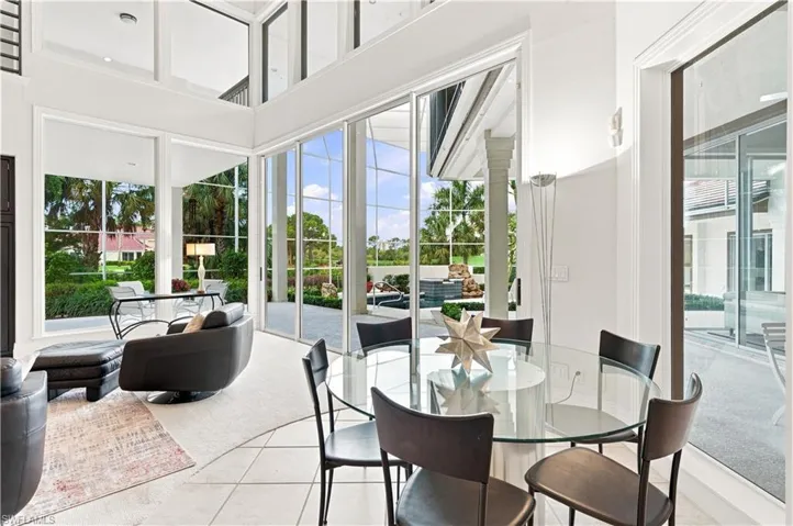 Walls of glass fill the home with natural light and bring the outdoors in.