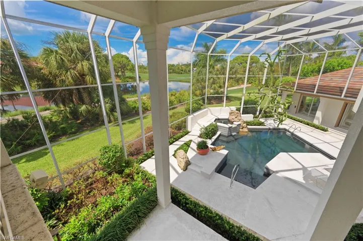 A private pool with lush surroundings.