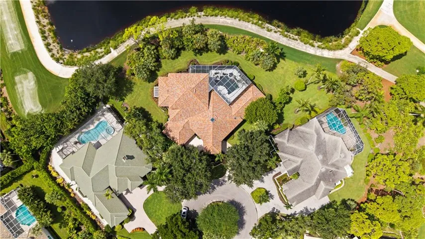 A bird’s-eye view showcases the home’s spacious homesite and private pool setting.