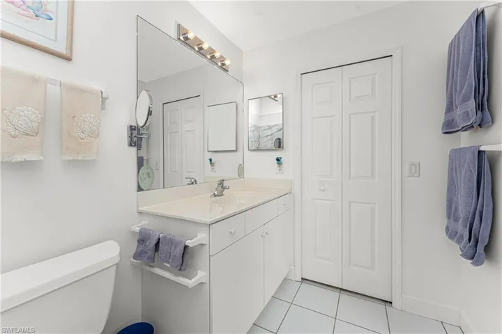Bathroom with tile patterned flooring, vanity, and toilet