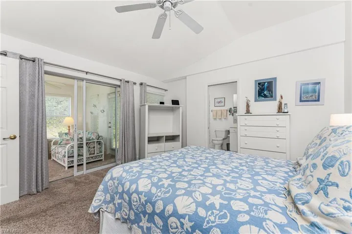 Bedroom with lofted ceiling, access to outside, carpet, and ceiling fan