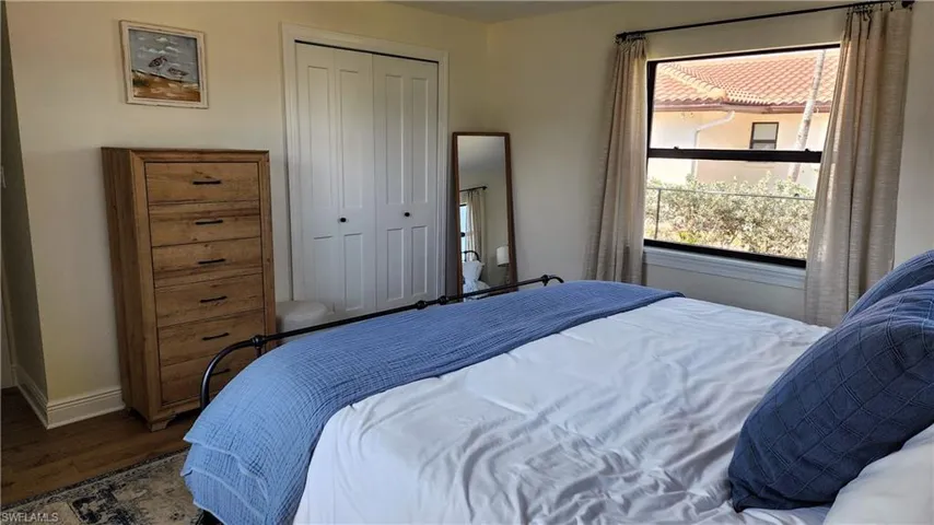 Bedroom featuring LVP flooring and a closet