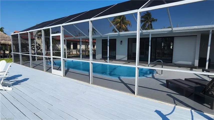 View of pool with a deck