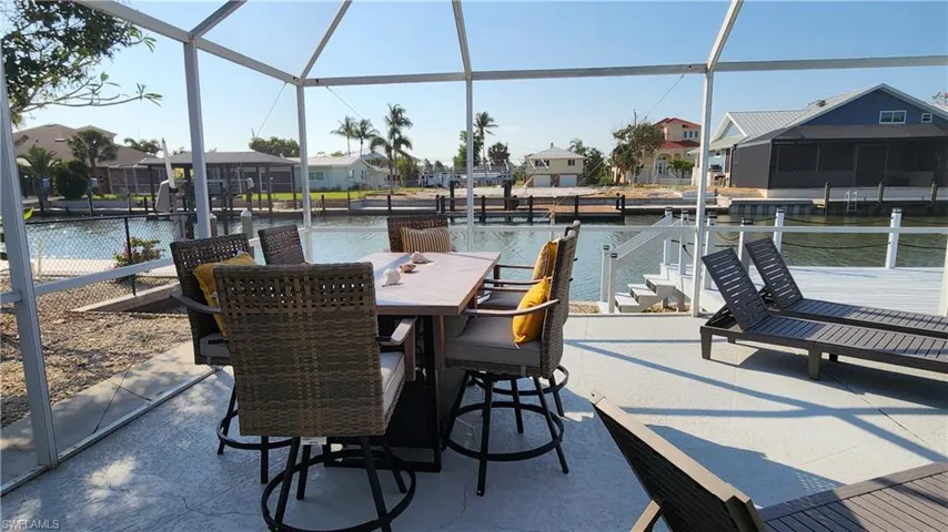 There's lots of room in the lanai featuring a water view