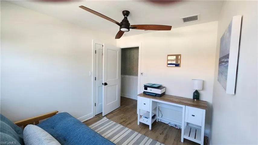Home office with LVP flooring and ceiling fan