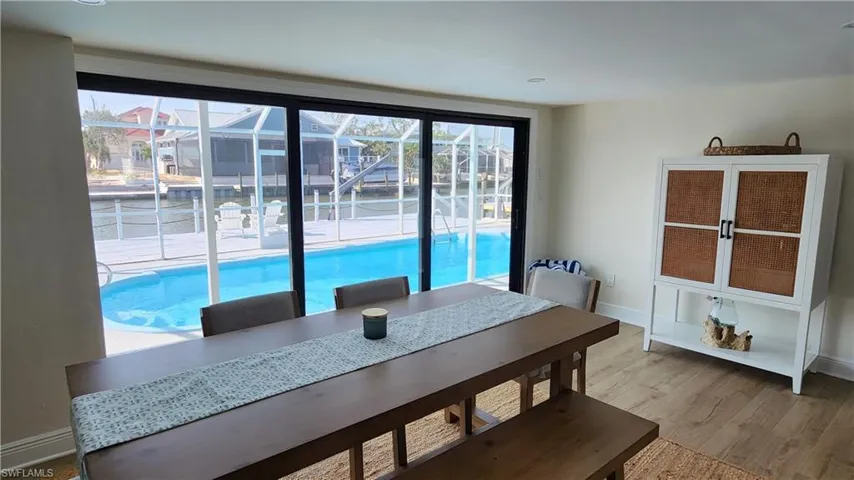 Dining area with hardwood / wood-style flooring