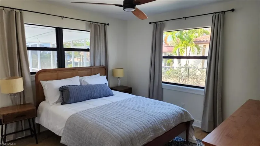 Bedroom with LVP flooring and ceiling fan