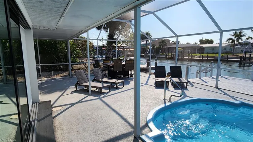 View of pool (newly fiber glassed) featuring a massive patio area
