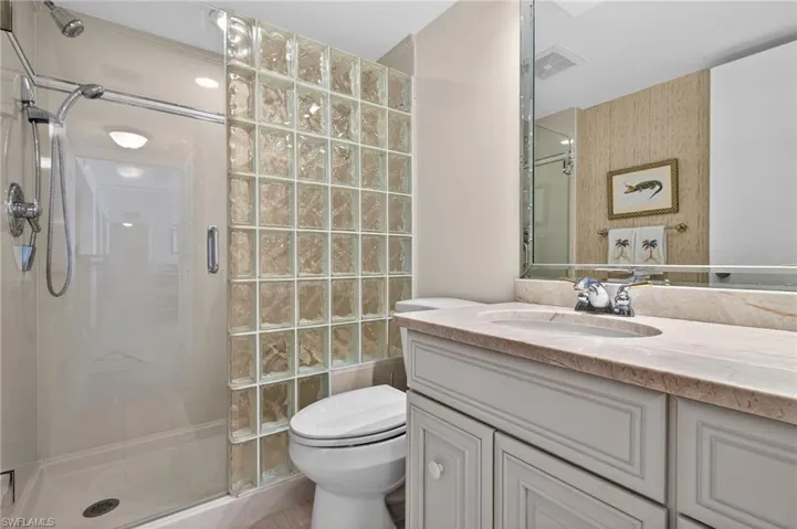 Full bath featuring vanity and a shower stall